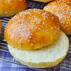 sesame seed bagels on a cooling rack