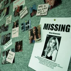 a bulletin board with missing pictures pinned to it