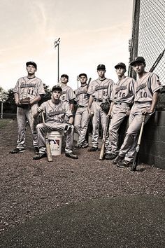 a group of baseball players standing next to each other