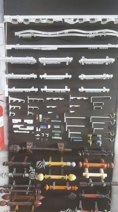 there are many different types of tools hanging on the wall