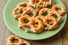 some pretzels are on a green plate