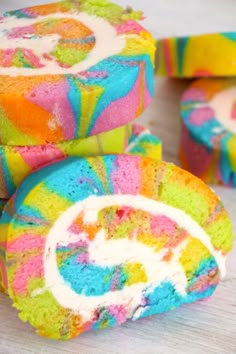 several colorfully decorated cookies sitting on top of a table