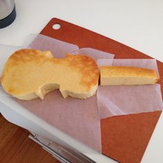 a piece of bread sitting on top of a cutting board