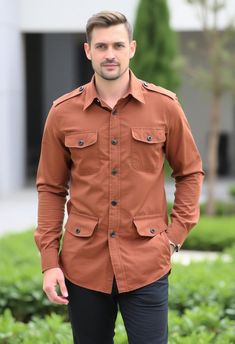 This brown military-style utility shirt offers both functionality and fashion. Featuring buttoned pockets, shoulder epaulets, and a tailored fit, it's perfect for casual or semi-formal occasions. The rich brown color adds a stylish touch, making it a versatile addition to any wardrobe for everyday wear or special outings. All shirts come in standard US sizes Made in Brown color thick cotton fabric.Fit for mountaineering, hiking, traveling, camping, running and other outdoor activities Dry Clean Only: Made in India Fall Khaki Shirt With Buttoned Pockets, Utility Shirt With Buttons For Fall, Khaki Shirt With Patch Pockets For Fall, Khaki Shirt With Flap Pockets For Fall, Fall Utility Khaki Shirt, Utility Shirt With Flap Pockets For Outdoor, Casual Brown Shirt With Flap Pockets, Fall Utility Shirt With Buttons, Long Sleeve Shirt With Cargo Pockets For Work