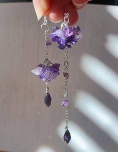 Wisteria amethyst earrings These wisteria earrings feature purple glass flowers and many amethyst crystals. Let's keep wisteria blooming! Available in silver finish! Also can make in gold.  * S I Z E  - Length: 90mm(without hook) - Width: 12mm Purple Crystal Jewelry, Elegant Lavender Jewelry With Natural Stones, Delicate Dangle Earrings For Mother's Day, Delicate Dangle Jewelry For Mother's Day, Sterling Silver Dangle Jewelry As Gift For Mom, Mother's Day Delicate Dangle Jewelry, Purple Long Drop Jewelry For Gift, Elegant Dangle Jewelry For Mom, Hypoallergenic Purple Jewelry For Wedding