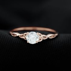 a gold ring with a white diamond in it