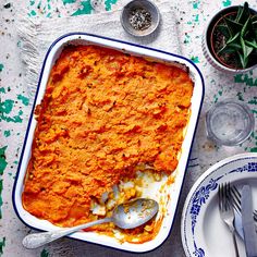 a casserole dish filled with mashed sweet potatoes