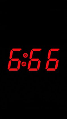 the digital clock is red in color on black background with space for text or image