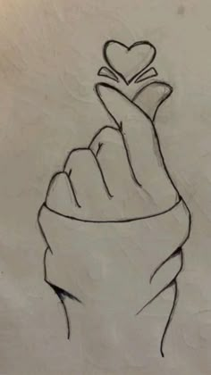 a drawing of a hand holding a heart