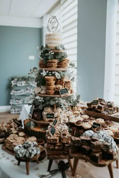 a table topped with lots of cookies and pastries