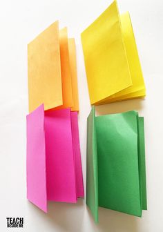 three pieces of paper folded in different colors on a white surface with text overlay