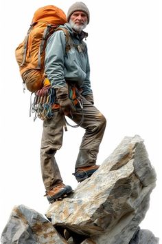 a man with a backpack standing on top of a rock