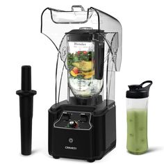 a blender with some liquid in it next to a shaker and a bottle