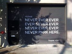 a parking garage door with a thank you sign on it