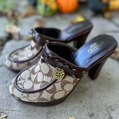 Coach Jodey Brown Heeled Mule/Clogs With Signature Coach Print & Brown Wooden Heel. Great Condition, Like New. Comes With Gold Coach Medallion. 3inch Heel Size 9 Coach Mules For Spring, Coach Leather Mules With Round Toe, Coach Slip-on Mules, Casual Clogs With 4-inch Heel, Heeled Mule, Brown Logo, Browning Logo, Brown Heels, Wooden Heel