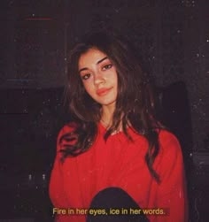 a woman in a red shirt with the words fire in her eyes, ice in her words