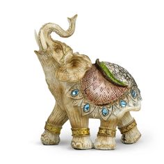 an elephant figurine with a hat on its back