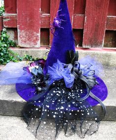 a purple witches hat sitting on top of a cement step