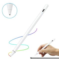 a person is holding a pen and writing on a white surface with different colored lines coming out of it