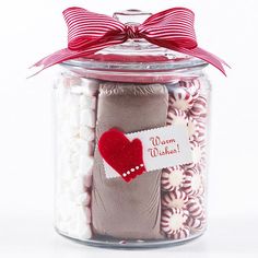 a jar filled with lots of candy and a red heart on the label that says i love you