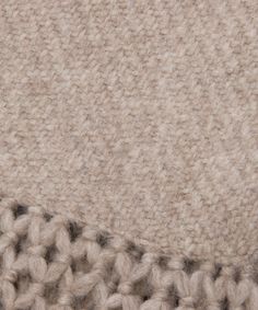 a close up view of the side of a knitted blanket