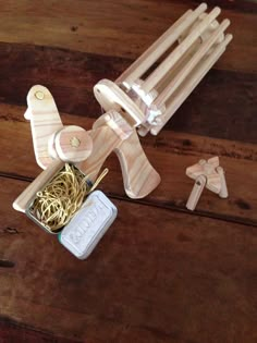 a wooden toy airplane and some pasta noodles