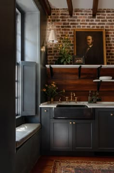 a kitchen with brick walls and wooden cabinets, an oven and sink in the center