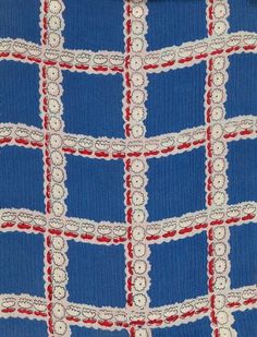 a blue and red checkered fabric with white lace