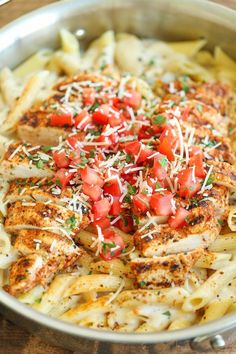 chicken with tomatoes and parmesan cheese on top