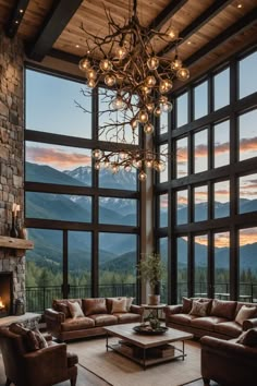 a living room filled with lots of furniture and a chandelier hanging from the ceiling