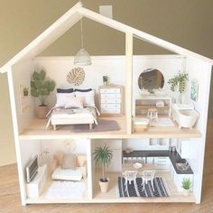 a doll house with furniture and accessories in it