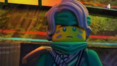 the lego movie character is wearing a scarf and looking at something in front of him