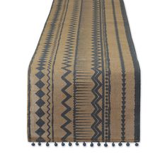 a brown and black rug with tassels on it