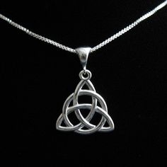 A simple and elegant sterling silver Celtic Trinity Knot, approximately 1 1/4 inch in diameter, and comes with an 18 inch sterling silver box chain. It's lovely and graceful and for the Celtic, Scottish or Irish in you, it's a complete pendant! *18 Inch 1.2mm Sterling Silver Box Chain * 1 inch diameter Celtic Knot Pendant with Bail in sterling silver Please allow me 2 days to fabricate your new necklace! Thank you for looking! Eternity Knot, Irish Necklace, Trinity Necklace, Celtic Knot Jewelry, Celtic Knot Necklace, Celtic Knot Pendant, Celtic Trinity Knot, Celtic Necklace, Celtic Knotwork