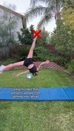 a man is doing a handstand on a blue mat in the yard with words above him