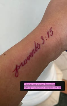 a person with a tattoo on their arm that reads provely 3 15 and has the word jesus written in red ink