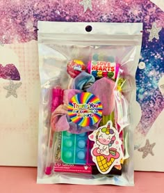 a bag filled with lots of different types of candy and candies in it's packaging