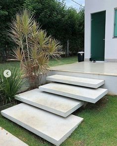 concrete steps leading up to the front door of a house