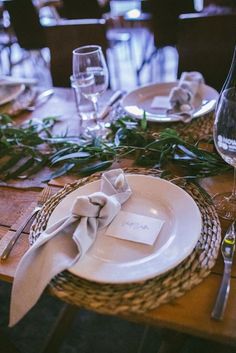 a table set with place settings and napkins