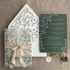 the wedding stationery is laid out on the table