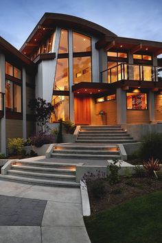 a large house with stairs leading up to it