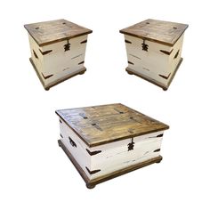 three white boxes with wooden lids and handles on each side, one in the shape of a chest