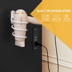 an electric outlet plugged in to a wall with a yellow and black background that says built - in power strip