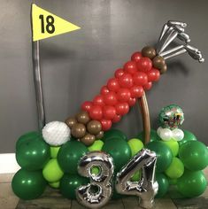 a balloon arch with the number eighteen on it