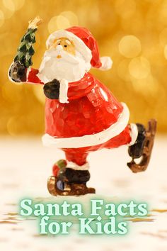 a santa clause figurine holding a christmas tree on top of a skateboard