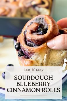 blueberry cinnamon rolls with text overlay reading fast and easy sourdough blueberry cinnamon rolls