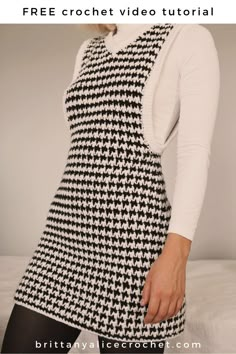 a woman wearing a black and white houndskin dress with the text free crochet video