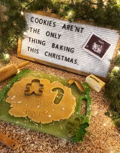 a sign that says cookies aren't the only thing baking this christmas