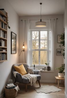 a living room with a couch, chair and bookshelf next to a window