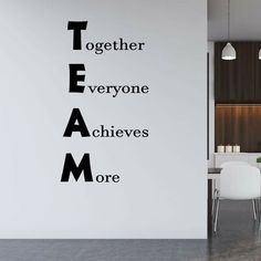 a wall sticker with the words together everyone achieves more in black and white